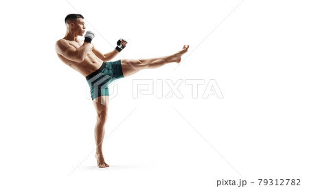 MMA kick. Sport concept. MMA fighter isolated on white background. Athlete. Side view MMA kick. Sport concept. MMA fighter isolated on white background. Athlete. Side view 79312782