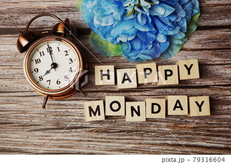 Happy Monday alphabet letter with alarm clock on wooden background Happy Monday alphabet letter with alarm clock on wooden background 79316604