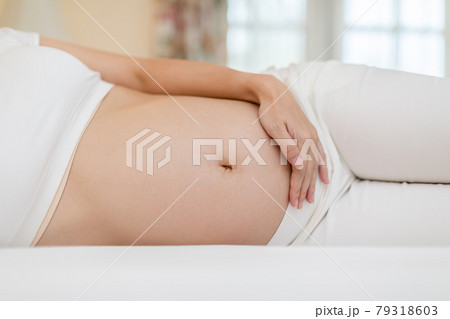 Happy Beautiful Pregnant Asian Woman lying on bed smile and sleep with big belly so comfortable and relax,Pregnancy of young woman sleep and happy with future life,Motherhood and Pregnant Concept Happy Beautiful Pregnant Asian Woman lying on bed smile and sleep with big belly so comfortable and relax,Pregnancy of young woman sleep and happy with future life,Motherhood and Pregnant Concept 79318603