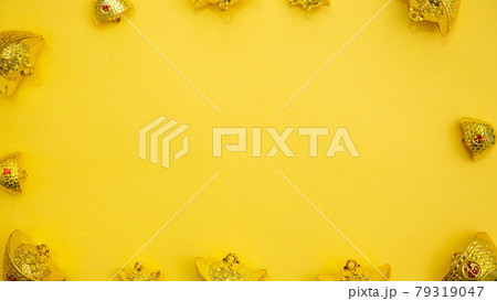 Lunar New Year decoration with lucky gold bar isolated on yellow . Tet Holiday.Translation of text appear in image: fortune good luck	 79319047
