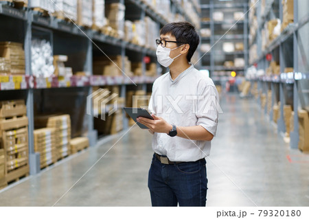 Portrait Asian men, staff, product counting Warehouse Control Manager Standing, counting and inspecting products in the warehouse Portrait Asian men, staff, product counting Warehouse Control Manager Standing, counting and inspecting products in the warehouse 79320180