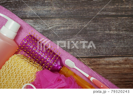 Shower accessories bath items shower gel, sponge, Hair Brush, fibre scrub on wooden background 79320243