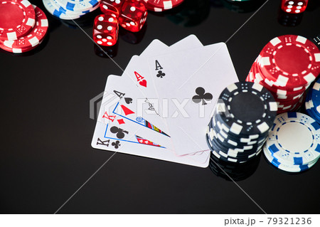 Casino chips, playing cards and dices on dark reflective background 79321236