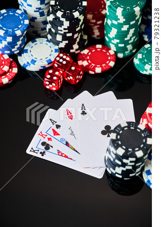 Casino chips, playing cards and dices on dark reflective background 79321238