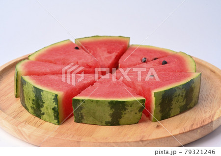 Slices of watermelon on wooden plate. Slices of watermelon on wooden plate. 79321246