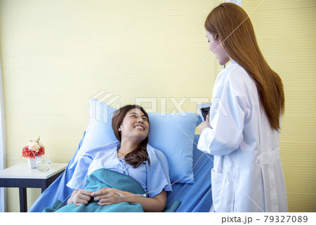 Woman doctor and patient consultation with professional specialist diagnostics at hospital medicare treatment clinic. Doctor writing prescription for medical health care therapy. Woman doctor and patient consultation with professional specialist diagnostics at hospital medicare treatment clinic. Doctor writing prescription for medical health care therapy. 79327089