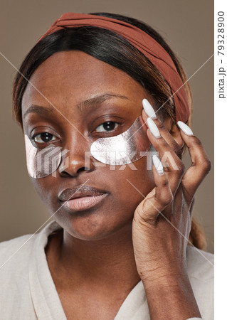 Beautiful African American Woman Using Moisturizer Patches 79328900