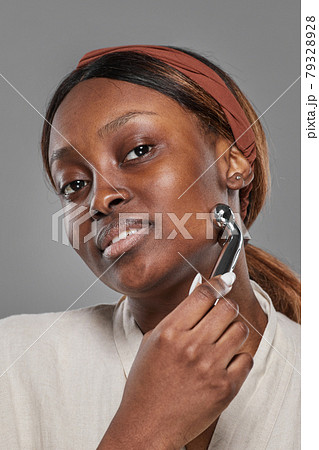 Beautiful African American Woman Enjoying Face Massage 79328928