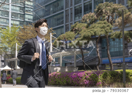 Asian man employee on the way to work 79330367