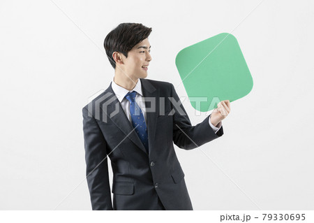 happy Asian man pointing at copyspace app banner 79330695