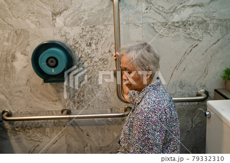 Asian senior or elderly old lady woman patient use toilet bathroom handle security in nursing hospital ward, healthy strong medical concept. Asian senior or elderly old lady woman patient use toilet bathroom handle security in nursing hospital ward, healthy strong medical concept. 79332310