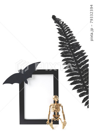 Black Vertical Frame Mockup. Styled Stock Photography. Halloween concept with stylish details skeleton and black leaves. 79332394