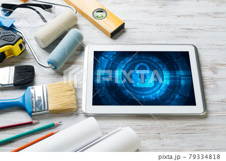 Web security and technology concept with tablet pc on wooden table 79334818