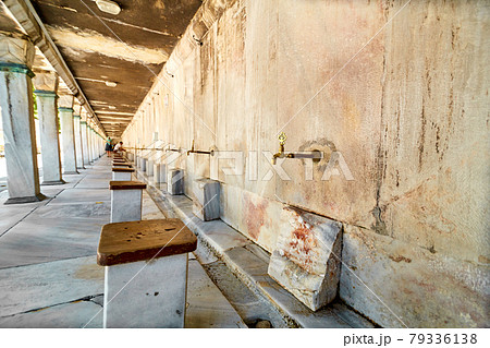 Taps with water for washing the feet for the entrance to the mosque Taps with water for washing the feet for the entrance to the mosque 79336138