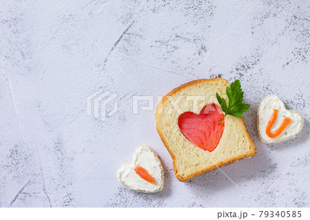 Breakfast for valentine's day or mother's day, toast with salmon and curd cheese with the inscription that I love you.Top view flat lay. Copy space. Breakfast for valentine's day or mother's day, toast with salmon and curd cheese with the inscription that I love you.Top view flat lay. Copy space. 79340585