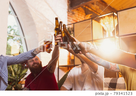 Group of young people, friends spending time together, drinking beer. Concept of friendship, leisure activity, emotions Group of young people, friends spending time together, drinking beer. Concept of friendship, leisure activity, emotions 79341523