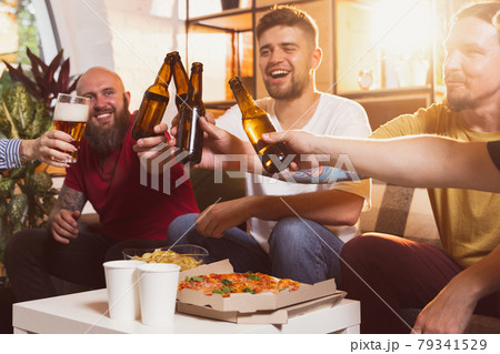 Close-up view of group of young people spending time together. Concept of friendship, leisure activity, emotions Close-up view of group of young people spending time together. Concept of friendship, leisure activity, emotions 79341529