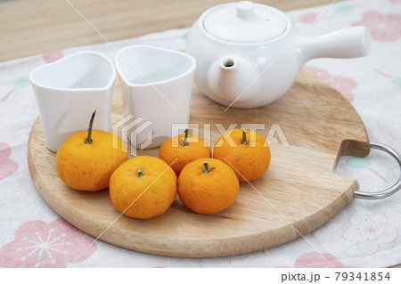 Fresh juicy clementine mandarins on wooden board Fresh juicy clementine mandarins on wooden board 79341854