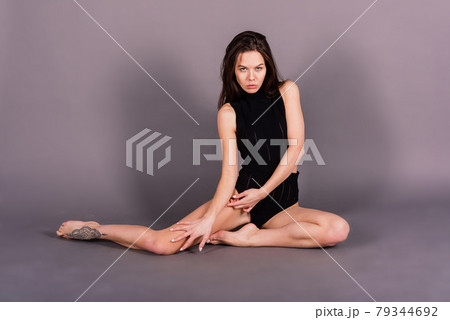 Young and beautiful dancer posing in studio 79344692