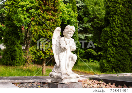 White angel statue in the park closeup 79345494