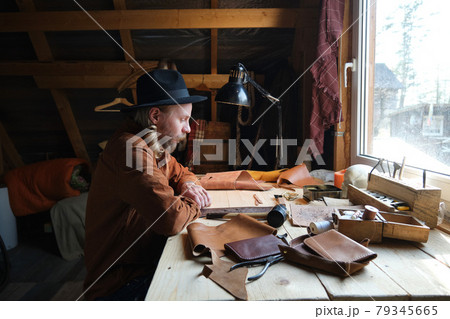 Carpenter sewing products from leather 79345665