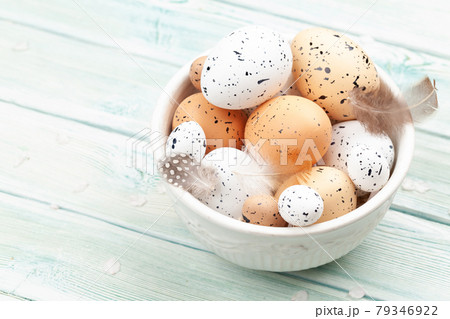 Chicken and quail eggs in bowl Chicken and quail eggs in bowl 79346922