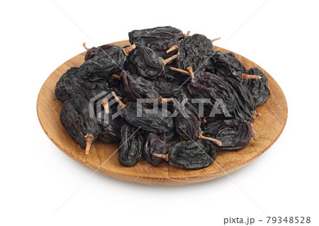 Yellow raisins in wooden bowl isolated on white background with clipping path and full depth of field Yellow raisins in wooden bowl isolated on white background with clipping path and full depth of field 79348528