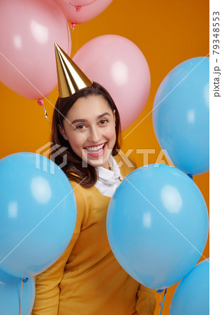 Funny woman in cap, birthday celebration 79348553