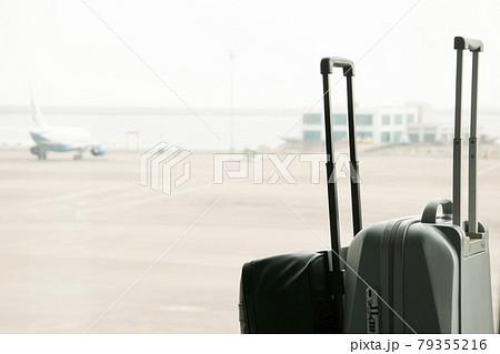 traveling luggage in airport terminal 79355216