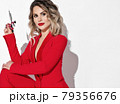 Young woman permanent makeup master in red jacket 79356676