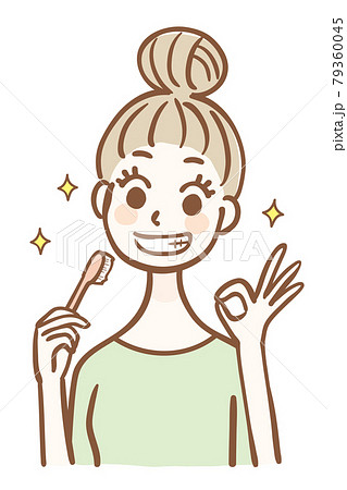 歯ブラシを持ってOKサインをする若い女性 79360045