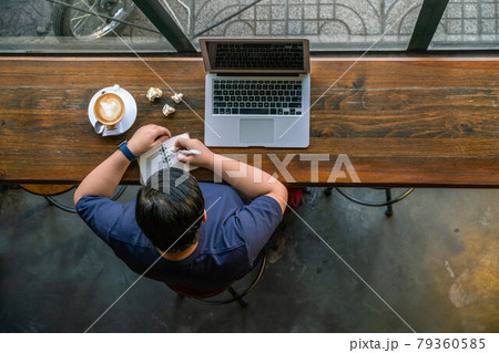 High angle view of short-hair student writing notes 79360585
