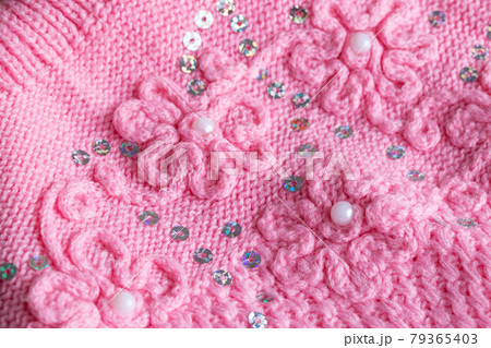 Handmade Knitted Pink Warm Sweater, macro. Background Handmade Knitted Pink Warm Sweater, macro. Background 79365403