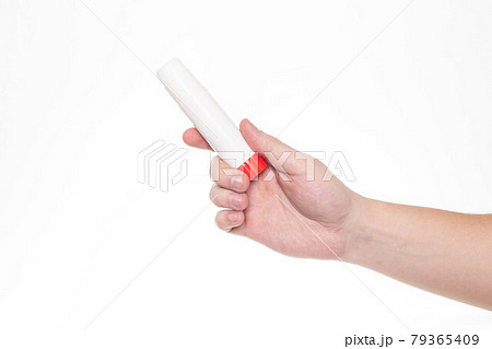 Man holds a glue stick in his hand on a white background, isolate. Close-up 79365409