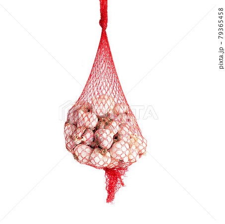 Red mesh garlic on a white background, isolate. Close-up, white-skinned garlic 79365458
