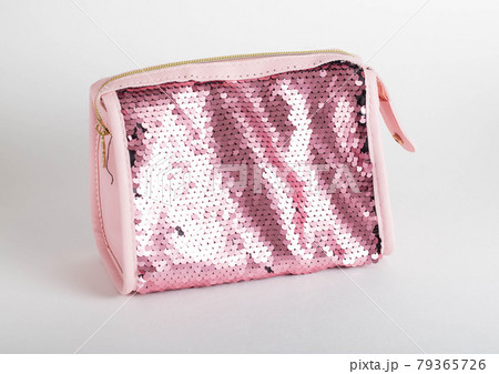 Pink shiny cosmetic bag on white background, isolate. Cosmetician Pink shiny cosmetic bag on white background, isolate. Cosmetician 79365726