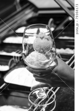 customer holding italian gelato ice cream at modern shop display 79368173