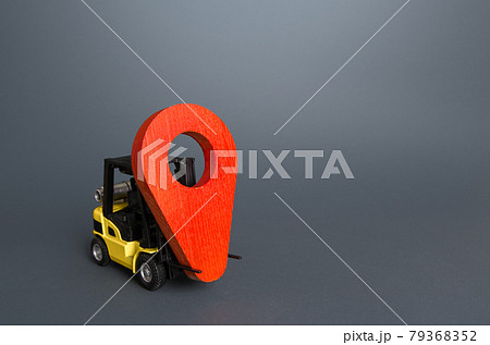 Yellow forklift carries a red location pin pointer. Transportation services and logistics, warehouse management. Real-time tracking of deliveries and goods. Freight infrastructure, redeployment Yellow forklift carries a red location pin pointer. Transportation services and logistics, warehouse management. Real-time tracking of deliveries and goods. Freight infrastructure, redeployment 79368352
