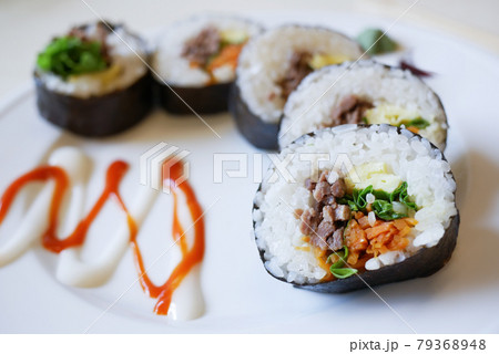 tuna Sushi on plate with chopstick on table  79368948