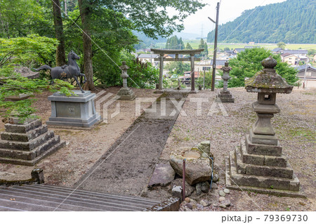 Torii gate, horse statue, lanterns at Mikami shrine, Japan. 79369730