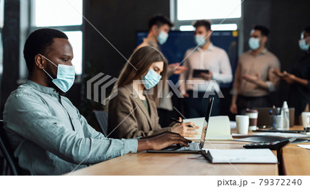 Colleagues having meeting in boardroom, working on startup project 79372240