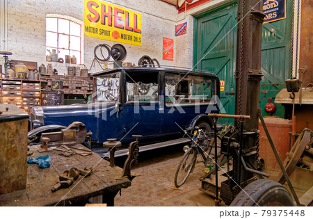 Vintage car in an workshop in Beamish Village - UK 79375448