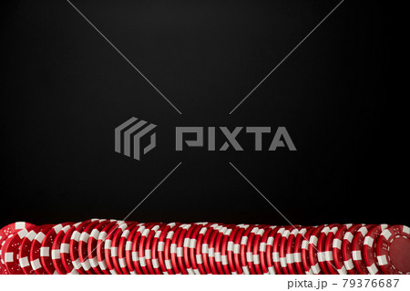 Stack of Casino gambling chips isolated on black reflective background 79376687
