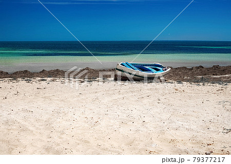 Wonderful views of the Mediterranean coast with birch water, white sand beach and a fishing boat 79377217