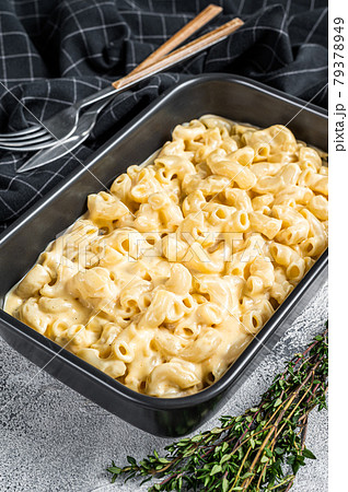 Mac and cheese american macaroni pasta with cheesy Cheddar sauce. White background. Top view Mac and cheese american macaroni pasta with cheesy Cheddar sauce. White background. Top view 79378949