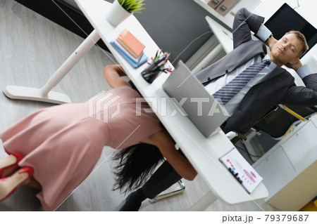 Young woman secretary and director having oral sex in office 79379687