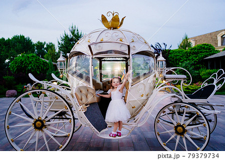 little girl in the carriage. A fabulous holiday for a child. little girl in the carriage. A fabulous holiday for a child. 79379734