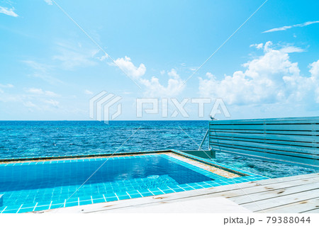 swimming pool with sea background in Maldives 79388044