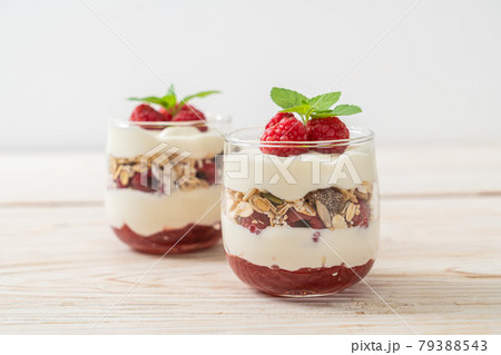 fresh raspberry and yogurt with granola 79388543