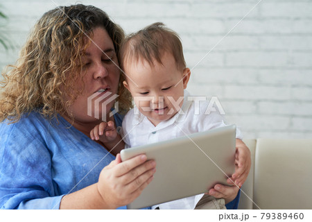 Mother and Son Watching Animated Cartoon 79389460